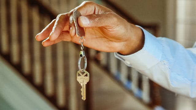 person-holding-hanging-keys